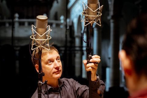 Audio technician setting up a microphone for Album Recording of Sollazzo Ensemble (2023)