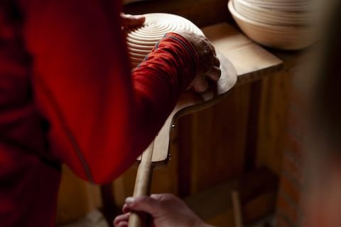 Putting bread in the oven (2024)