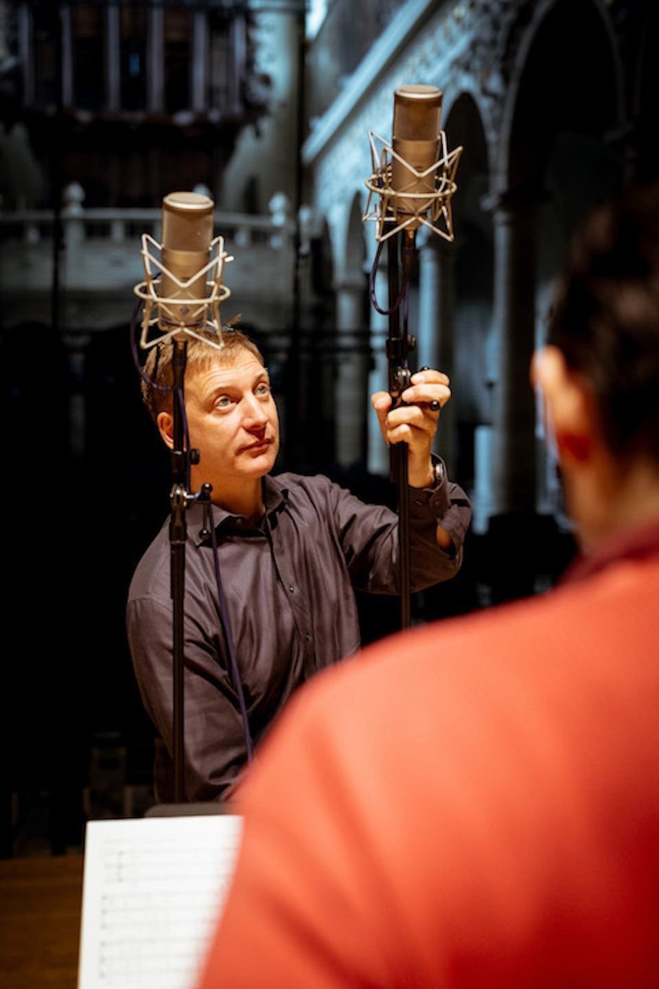 Audio technician setting up a microphone for Album Recording of Sollazzo Ensemble (2023)